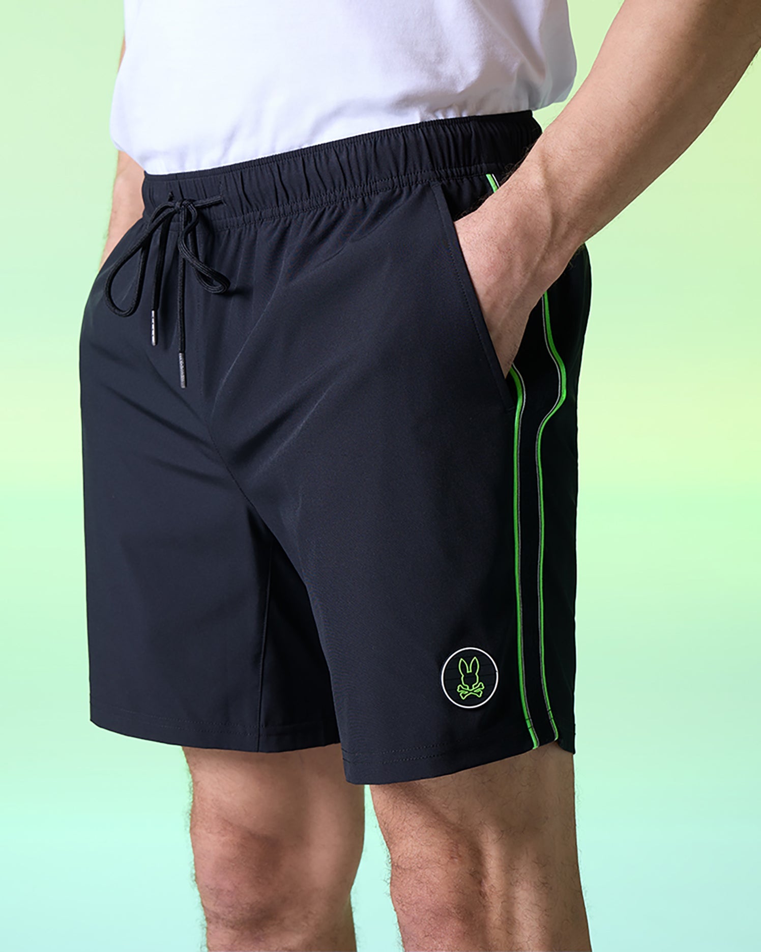 A man wearing Psycho Bunny MENS SONTERRA STRIPE SPORT SHORT - B6R464C200 with a white shirt.