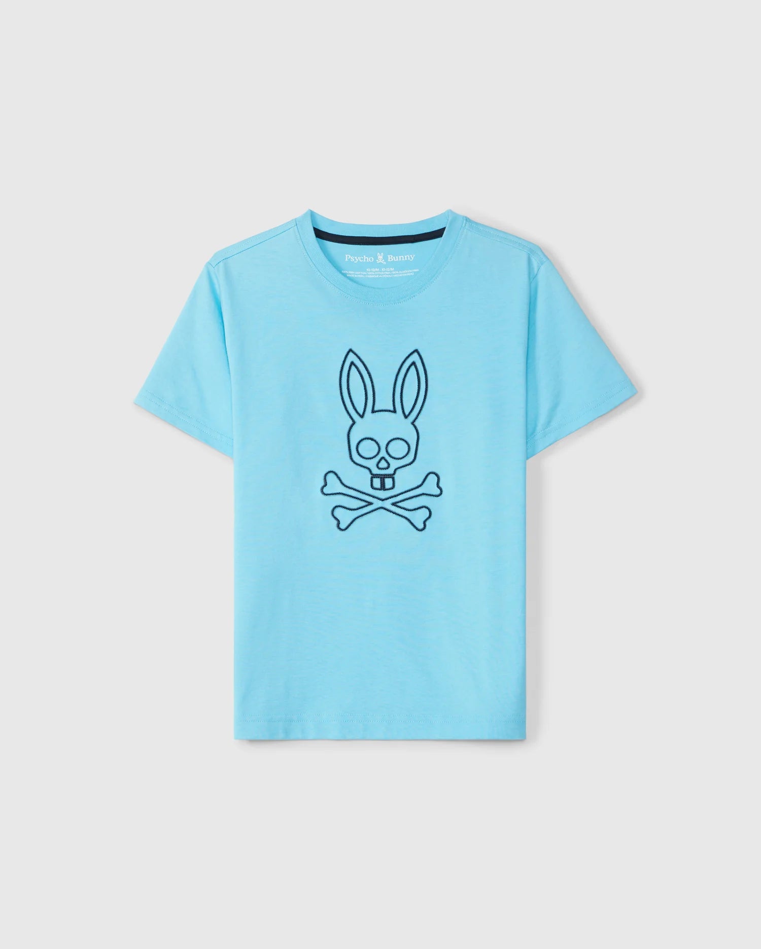 The KIDS SHELDON GRAPHIC TEE - B0U569C200 by Psycho Bunny is a light blue tee with a stylized bunny skull and crossbones design on the front, crafted from soft Pima cotton and displayed against a plain background.