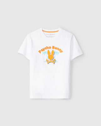 The KIDS BOSTON GRAPHIC TEE - B0U573C200 by Psycho Bunny is a high-quality cotton, white short-sleeve t-shirt that showcases an orange bunny with crossed bones beneath it at the center. "Psycho Bunny" is printed in orange above the graphic. This kids' graphic t-shirt is displayed against a plain light gray background.