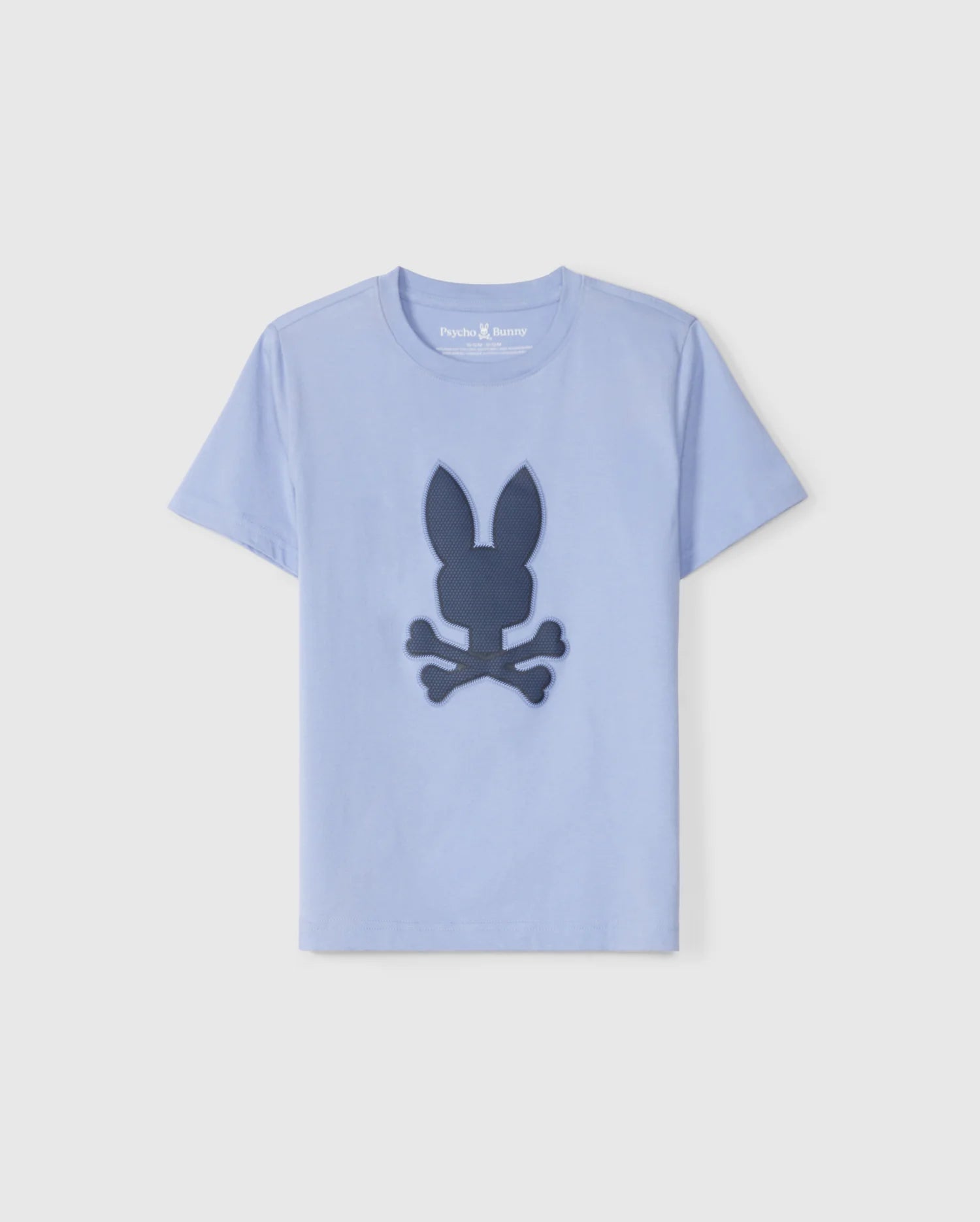 A light blue short-sleeve graphic tee crafted from luxurious Peruvian Pima cotton, featuring a dark blue graphic on the front of a rabbit head with crossed bones beneath it, resembling a playful skull and crossbones design. The label inside the collar reads 