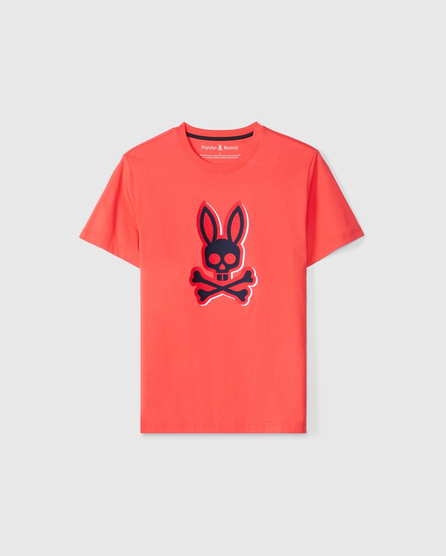 The KIDS KAYDEN GRAPHIC TEE - B0U676C200 from Psycho Bunny is a vibrant red Pima cotton shirt featuring a prominent black bunny skull with crossbones design on the front. This stylish graphic tee is showcased against a plain, light-colored background.