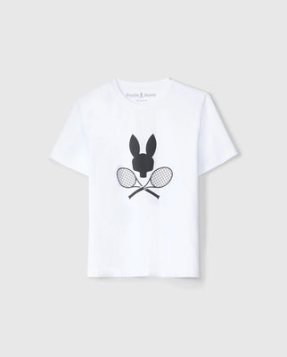 The Psycho Bunny KIDS COURTSIDE GRAPHIC TEE (B0U681C200) is a tennis-inspired white tee featuring a sleek black silhouette of a bunny head above crossed tennis rackets, ideal for fans of sporty graphic tees.