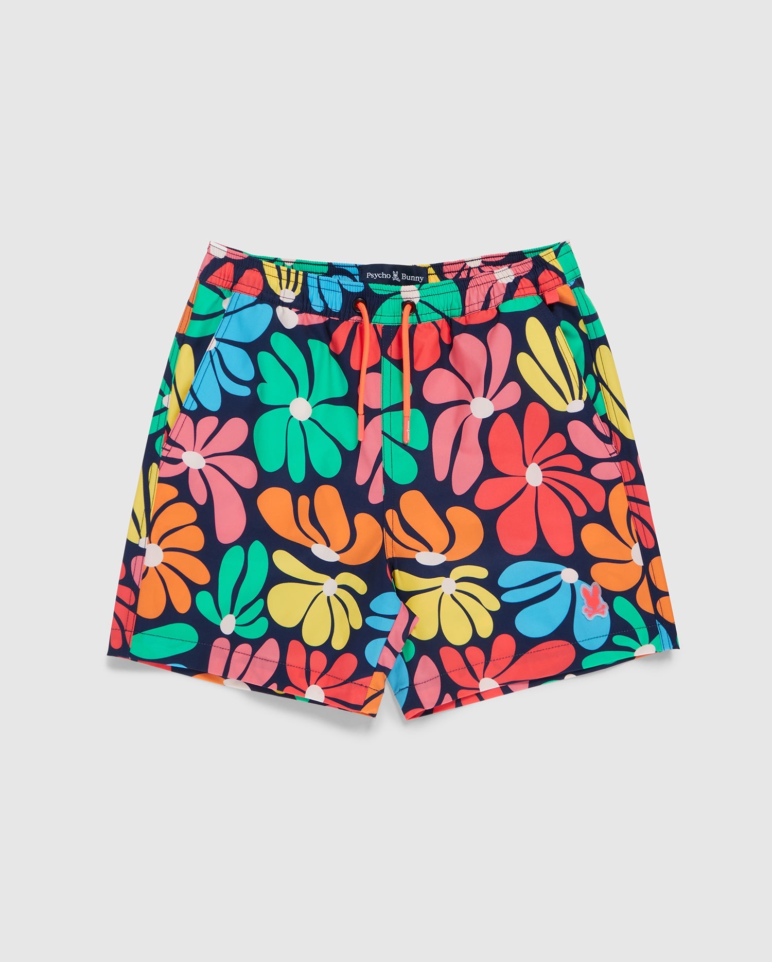 Introducing the Psycho Bunny Kids Mentz Swim Trunk - B0W320B2SW: colorful swim shorts with a vibrant floral pattern in shades of red, blue, green, pink, and orange on a dark background. Designed for performance and comfort, they feature a drawstring waistband and quick-dry fabric perfect for your sunny adventures.