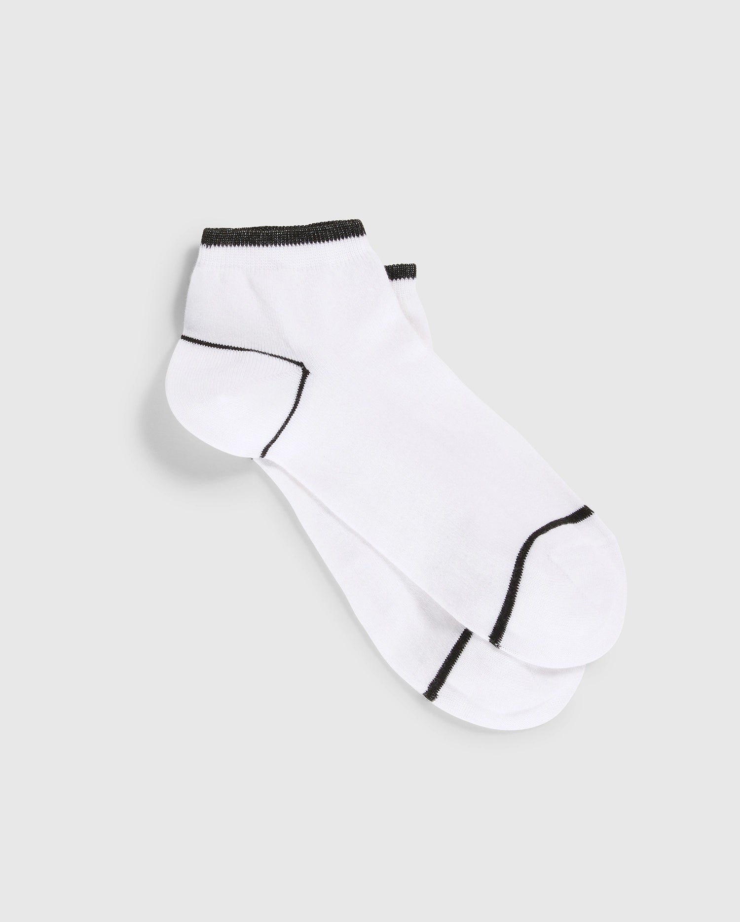 A pair of Psycho Bunny MENS ANKLE SOCKS - B6F482C200, made from white Pima cotton with black trim around the cuffs and black detailing on the toes and heels, featuring an embroidered Bunny emblem, neatly placed on a light grey background.