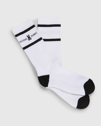 A pair of MENS FASHION SOCKS - B6F484B200 made from luxurious Pima cotton, featuring white with black toe and heel sections, two black horizontal stripes near the top, and a black bunny logo with the text "PSYCHO BUNNY" printed near the stripes. Made in Peru for exceptional quality by Psycho Bunny.