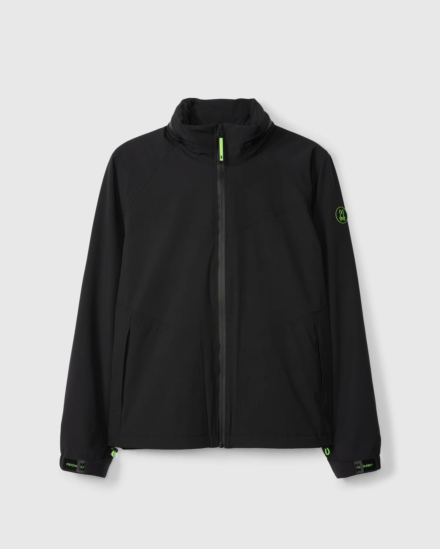 The MENS EZRA HOODED JACKET - B6J996D200 by Psycho Bunny, in black with a high collar and zip-up front, is displayed against a plain background. This weather-resistant jacket features minimalistic design elements such as waterproof zippers, two side pockets, and subtle green accents around the zipper, cuffs, and a small circular logo on the left sleeve.