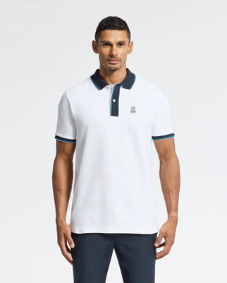 A man models the Psycho Bunny Men's Brandon Pique Polo (B6K280E200), a luxurious Pima cotton piece with a dark collar and trim, plus a small chest logo. Set against a plain background, he gazes at the camera, exuding premium quality.
.