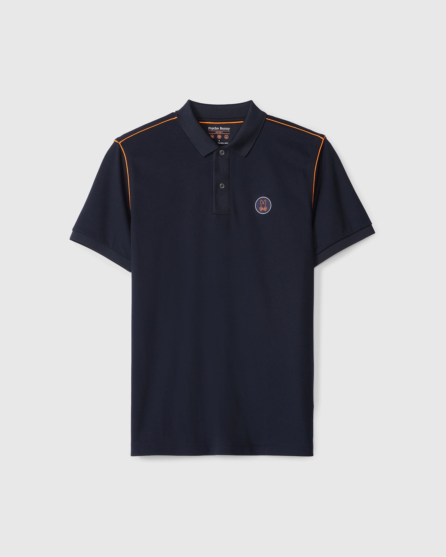 The Psycho Bunny MENS WEBSTER SPORT POLO SHIRT - B6K580C200 is a navy blue sport polo with short sleeves, a collar, three buttons, and orange piping along the shoulder seams. This moisture-wicking shirt features a small circular logo on the left chest, combining style with breathability.