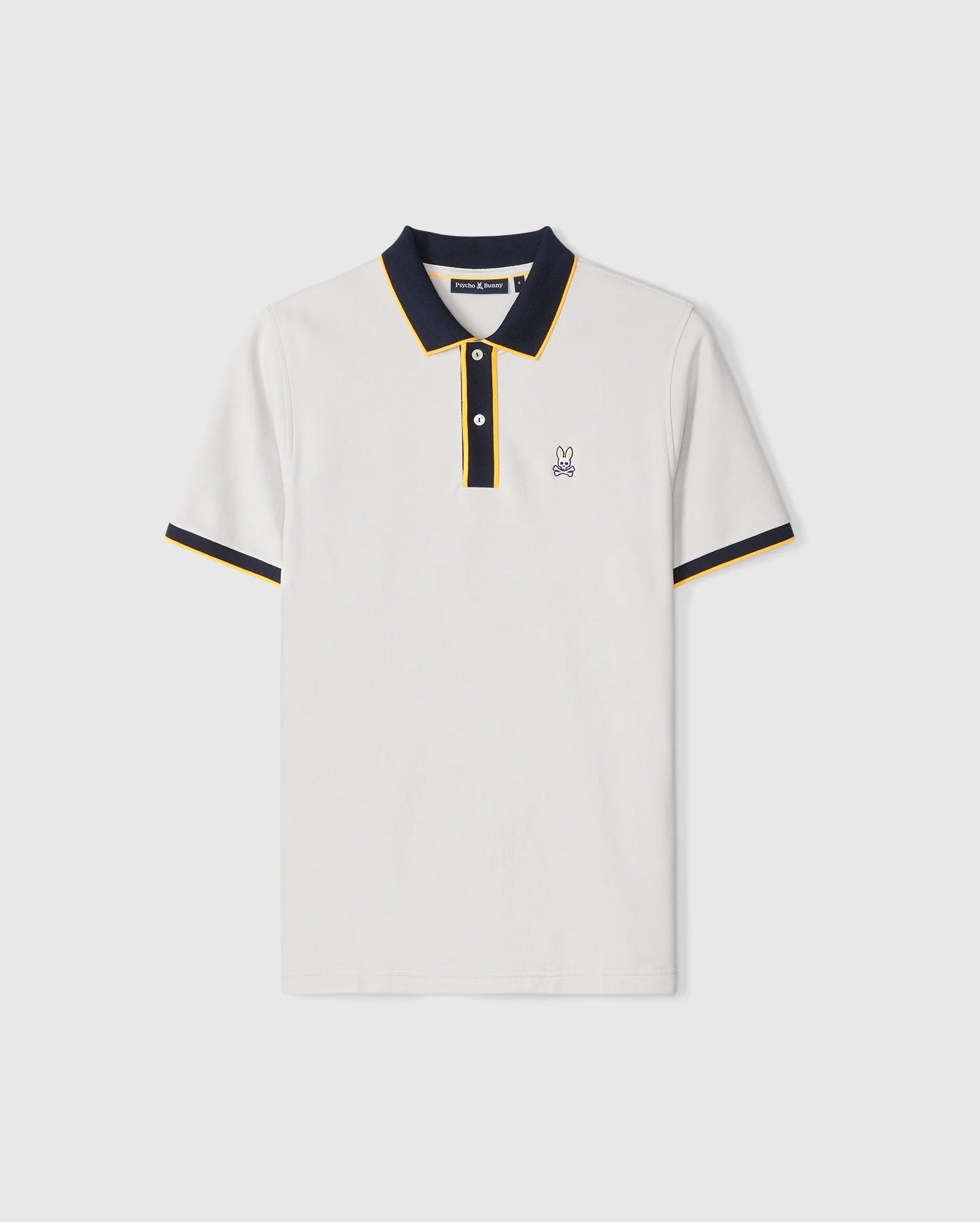 The MENS DALLAS PIQUE POLO SHIRT - B6K602C200 by Psycho Bunny is a white, short-sleeve Pima cotton polo shirt featuring navy blue and yellow trim on the collar and sleeve cuffs. It has a small embroidered rabbit logo on the left chest for an elegant touch. The two-button placket on the collar and the high-quality brand label sewn inside the back neck add to its premium design.