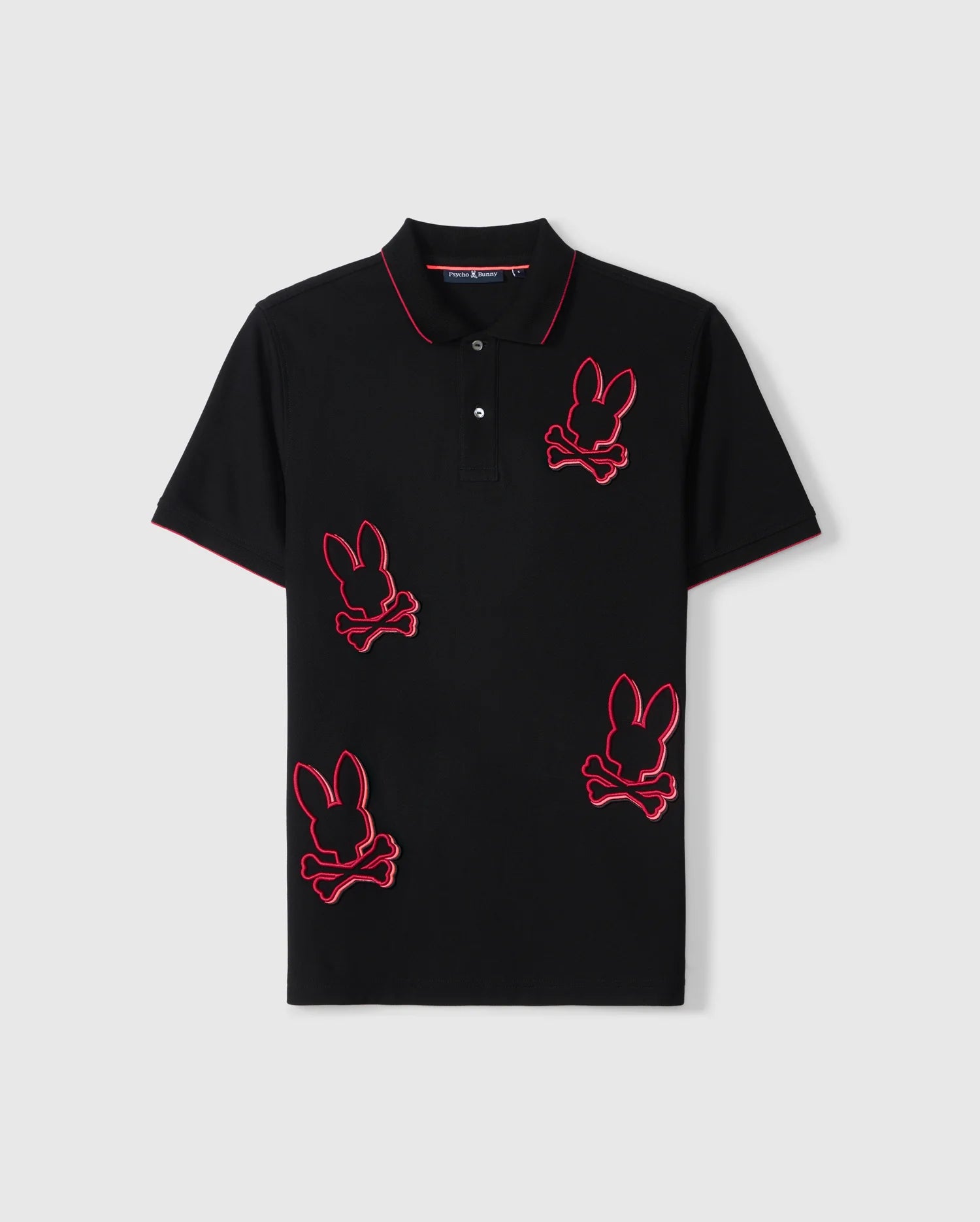 The Psycho Bunny MENS KARL PIQUE POLO SHIRT (B6K954D200) is crafted from Pima cotton and features red piping around the collar and sleeves. This black shirt is adorned with several asymmetrically placed, red-outlined bunny skull and crossbones patches on the front.