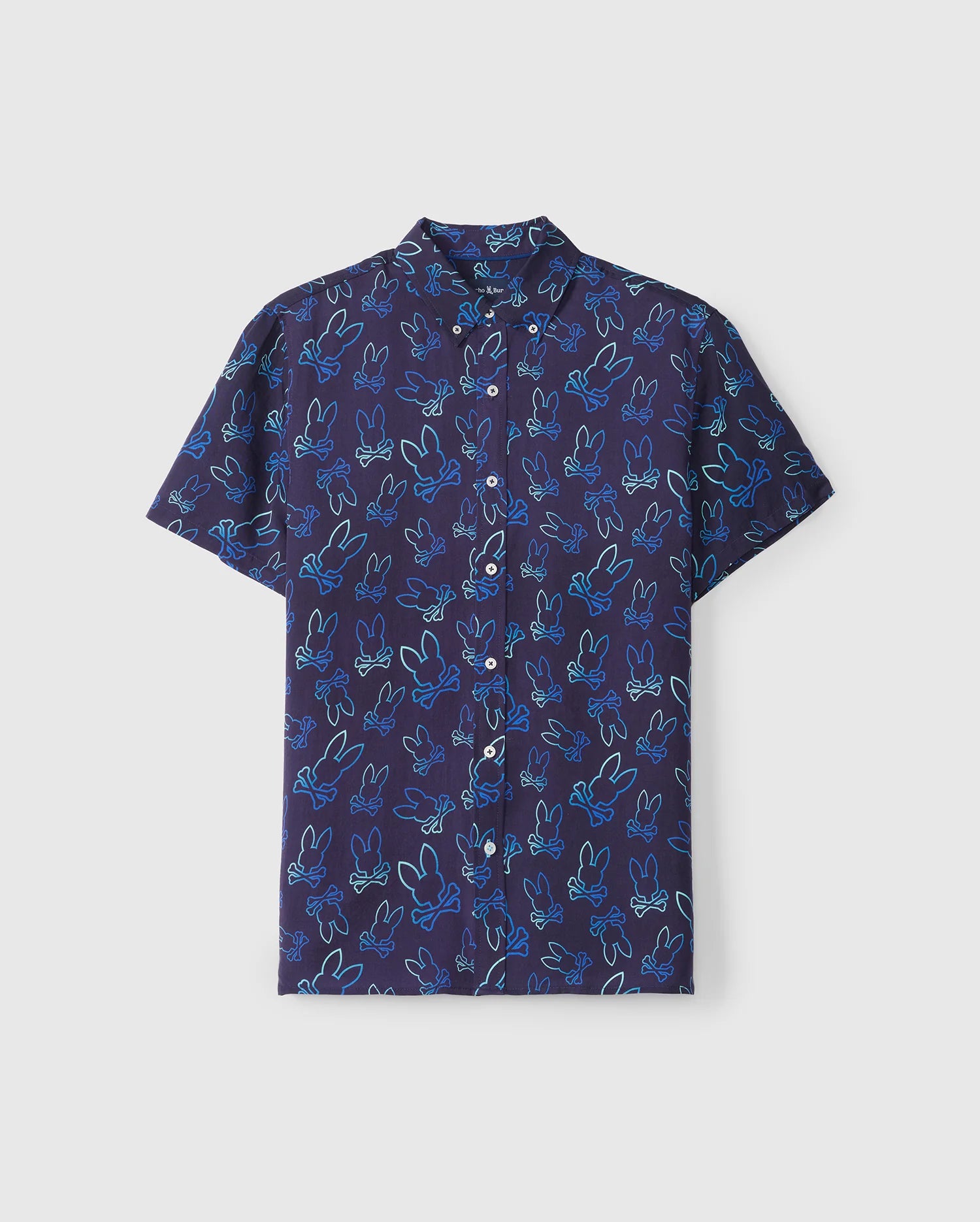 The Psycho Bunny MENS SHELDON ALL OVER PRINT SHIRT - B6Q574C200 is a short-sleeved, regular fit button-up shirt with a dark blue base, adorned with a playful bunny pattern in various shades of blue. Made from Pima cotton, this shirt features a classic collar and offers a relaxed yet stylish look.