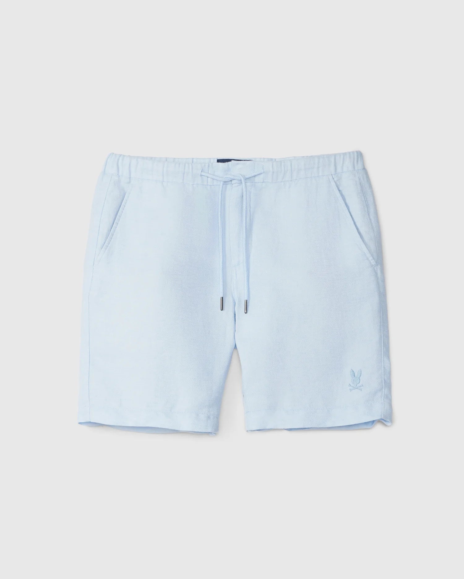 Light blue Psycho Bunny linen shorts with drawstring waist and a small logo on the left leg, displayed against a plain white background.