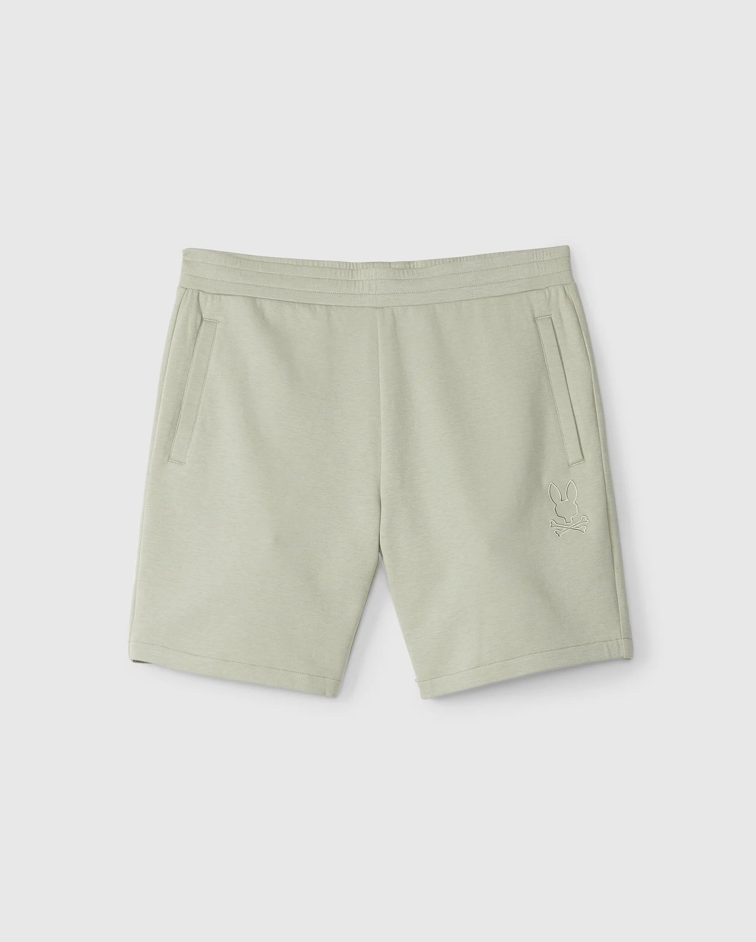 The MENS LYONS SWEATSHORT - B6R578C200 by Psycho Bunny are light grey casual sweatshorts crafted from a soft modal-cotton blend. They feature an elastic waistband, two side pockets, and a subtle embroidered Bunny appliqué on the lower left leg.