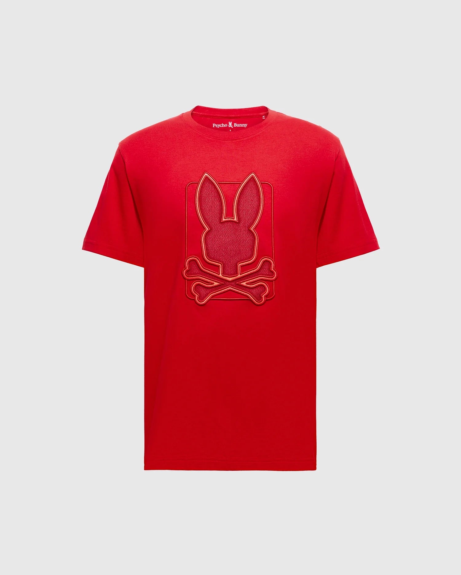 Elevate your wardrobe with the Psycho Bunny Men's Pierce Embroidered Graphic Tee – B6U115E200. Crafted from luxurious Pima cotton, this red T-shirt features an enchanting bunny embroidery that beautifully depicts a playful bunny head atop crossed bones. It's an ideal choice for those who love to blend style with a hint of whimsy.