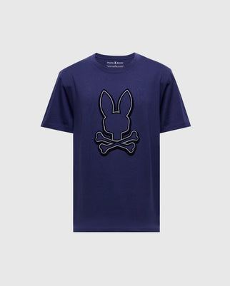 This Psycho Bunny Men's Alexander Graphic Tee in navy blue boasts a bold design, featuring bunny ears outlined above a skull and crossbones on the front, adding an edgy flair to your everyday wardrobe.