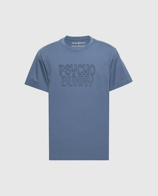 The MENS MONARC WORDMARK GRAPHIC TEE - B6U210E200 by Psycho Bunny is a blue, 100% Pima cotton T-shirt with "Psycho Bunny" embroidered on the front. It features a classic crew neckline and is made in Peru for ultimate comfort and style.