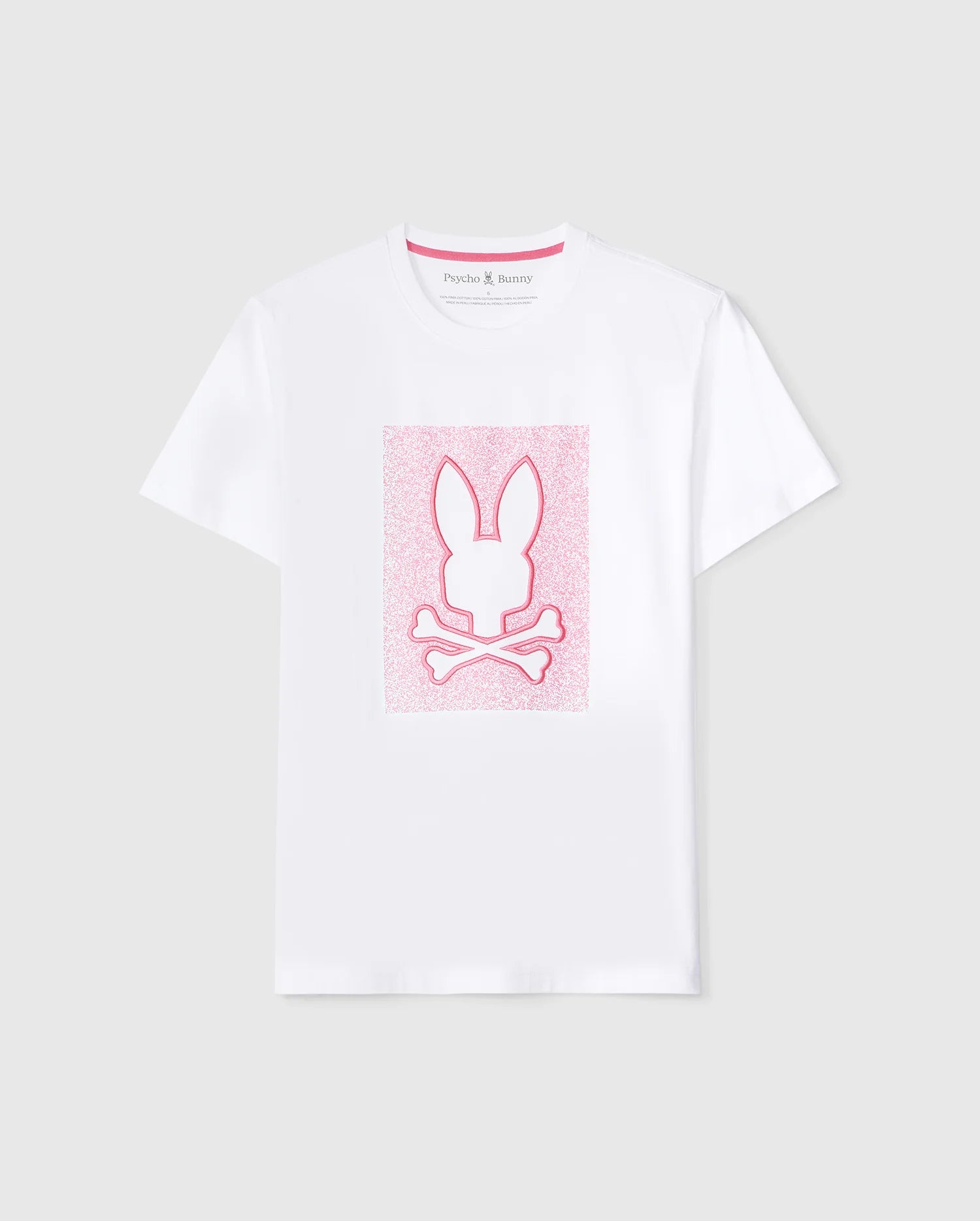 A white MENS LIVINGSTON GRAPHIC TEE - B6U247B2TS featuring a pink Bunny design in the center with an outline of a rabbit's head above a pair of crossed bones. The background of the graphic has a textured, glittery appearance. Crafted from soft Pima cotton, the collar tag reads 