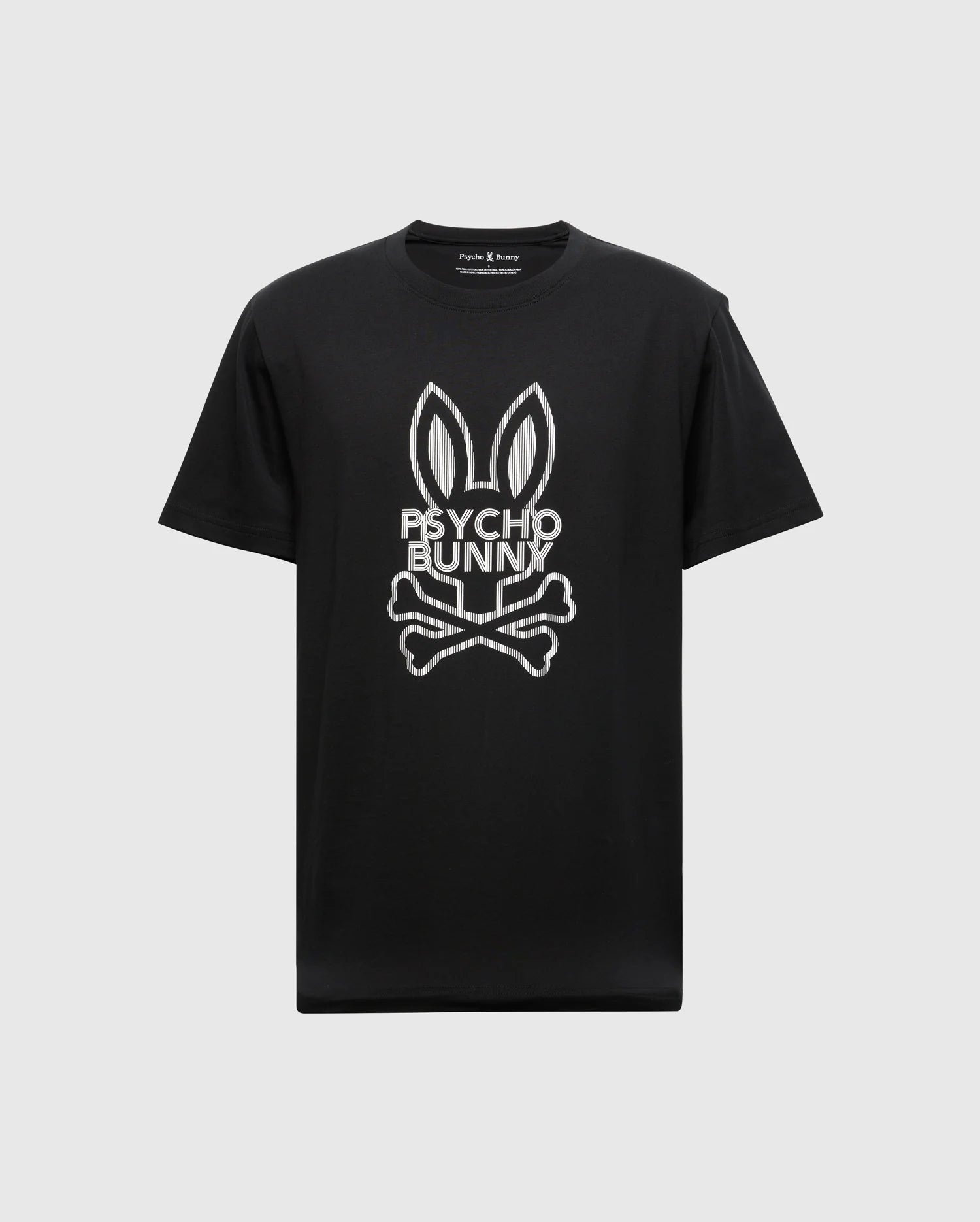 The MENS DUMON GRAPHIC TEE - B6U271E200 from Psycho Bunny showcases an eye-catching design featuring bunny ears above a skull and crossbones, with 