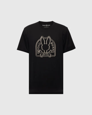 The MENS MELBOURNE GRAPHIC TEE (B6U410F200) by Psycho Bunny is a black eco-friendly Pima Cotton shirt featuring a stylized long-eared Bunny graphic above crossed bones, with "Psycho Bunny" text on a plain white background.