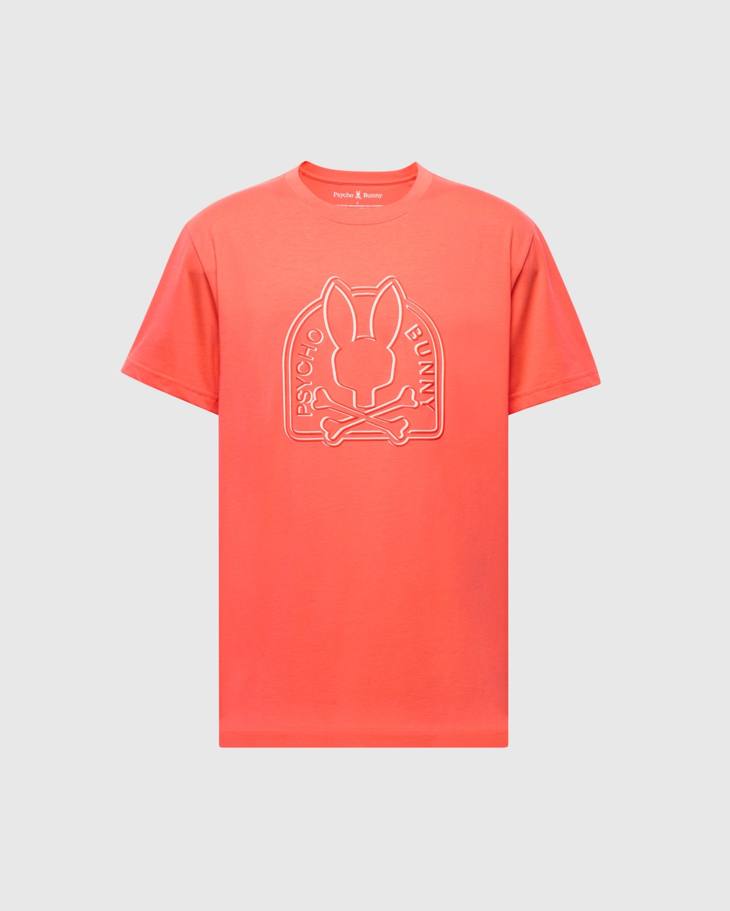 The bright coral MENS MELBOURNE GRAPHIC TEE (B6U410F200) by Psycho Bunny, made from eco-friendly Pima Cotton, showcases a front logo featuring a stylized rabbit head above crossbones with 