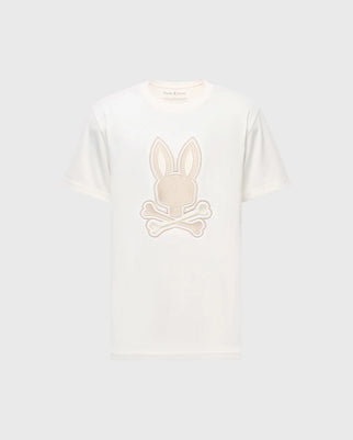 The Psycho Bunny MENS NEW CASTLE EMBROIDERED GRAPHIC TEE (B6U415F200) features a white Pima cotton base with an embroidered Bunny head graphic, ears up, above crossed bones on a light gray background.