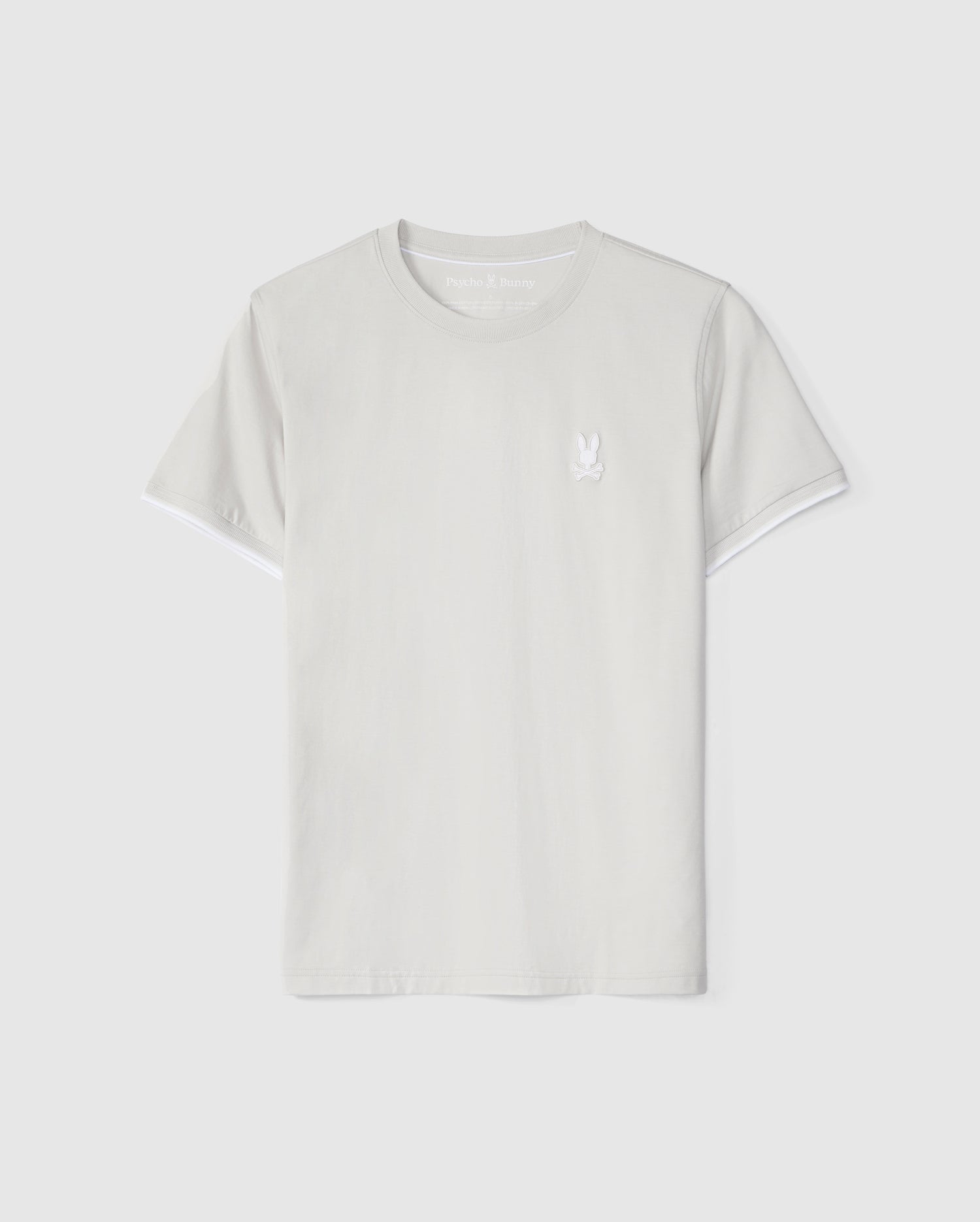 A plain white Psycho Bunny Pima cotton t-shirt with a small, embroidered dove logo on the left chest area displayed against a white background.