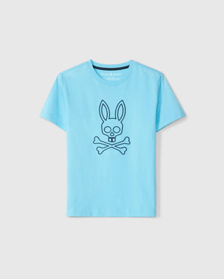 The Psycho Bunny MENS SHELDON GRAPHIC TEE - B6U569C200 in light blue is crafted from soft Pima cotton and features a striking bunny skull and crossbones design at the center, displayed against a plain white background.