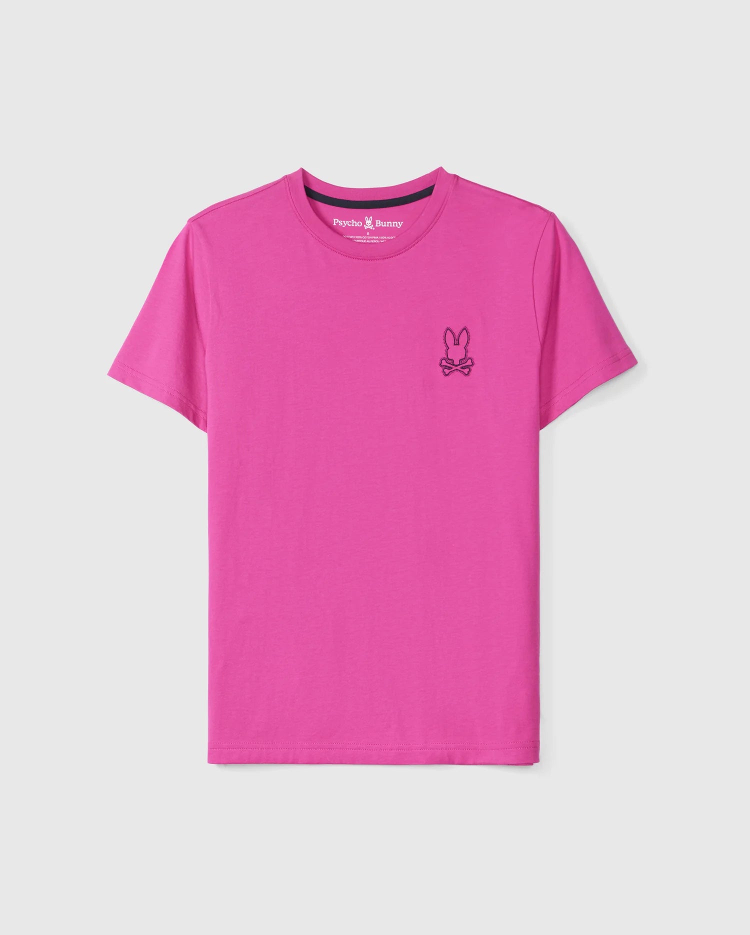 The MENS PEARLAND BACK GRAPHIC TEE - B6U632C200 from Psycho Bunny is a vibrant pink shirt featuring a small, black embroidered logo on the left chest. The logo consists of a bunny with crossbones underneath, adding a varsity aesthetic. Made from premium Pima cotton, this T-shirt has a round neckline and short sleeves, with an interior tag that reads 