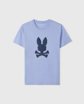 The Psycho Bunny Men's Riviera Graphic Tee - B6U639C200 features a large bunny with crossbones graphic on the chest, crafted from soft, durable Peruvian Pima cotton in blue for lasting comfort.