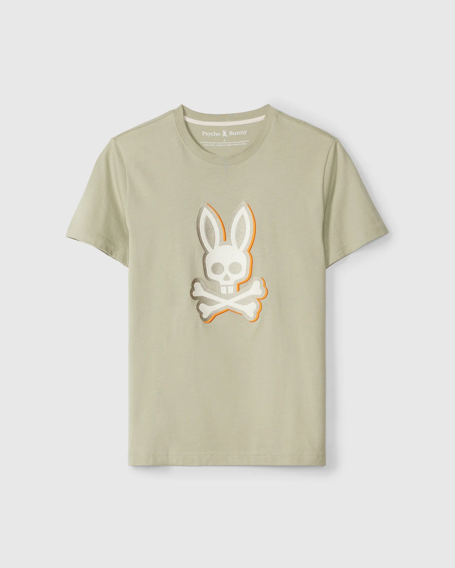 A light beige Pima cotton graphic tee with a white and gray skull and crossbones rabbit logo on the front. The skull has rabbit ears, and the crossbones are placed underneath. This Regular fit t-shirt features 