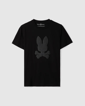 Introducing the Psycho Bunny MENS KINGSTON GRAPHIC TEE - B6U743D200, a black t-shirt crafted from soft Pima cotton. It showcases a textured bunny graphic of a rabbit over two crossbones printed on the front.